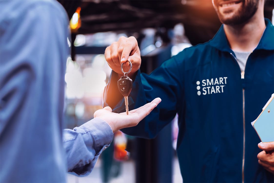 Smart Start technician handing car keys to a customer